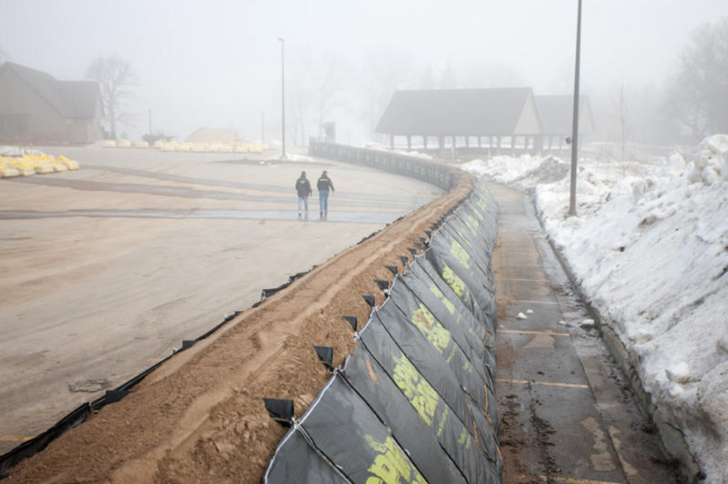 TrapBags used as a flood barrier protecting a roadway