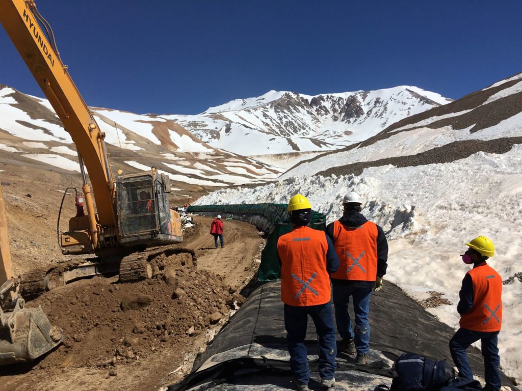 Construction crew on spill control barrier for gold mine in Argentina