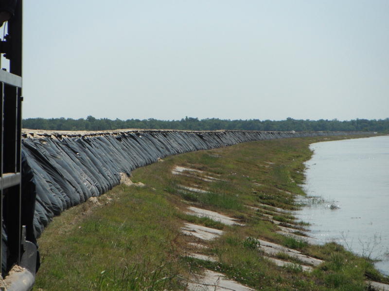 Expansive levee built with TrapBag control barrier bags