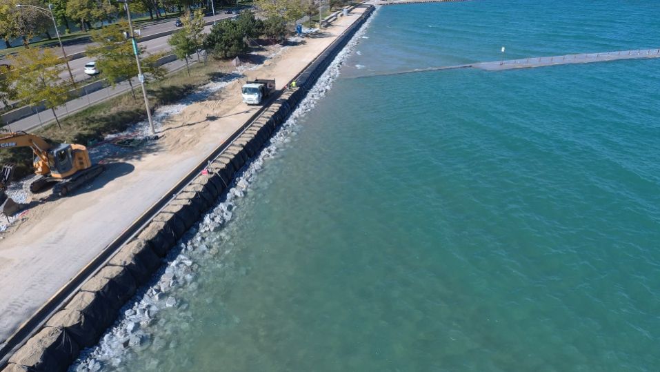 A levee system pictured on shore of Chicago. It is a flood barrier made of bags and concrete reinforcement.