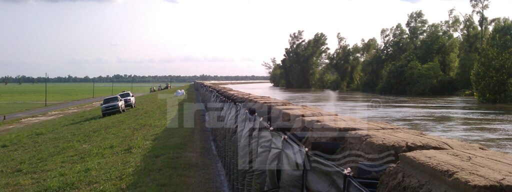 Expansive levee built with TrapBag control barrier bags